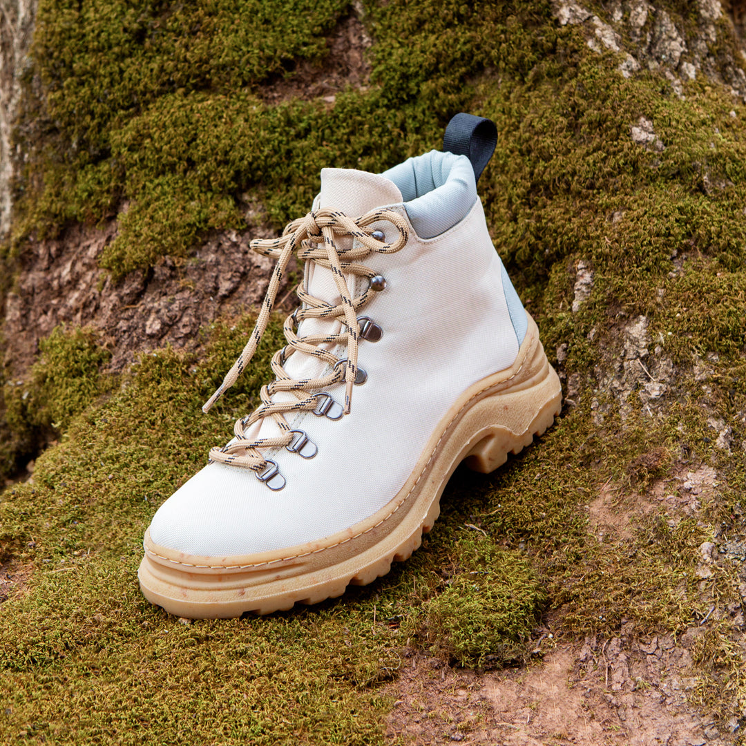 The vegan + sustainable white hiking boot, stylish side view.